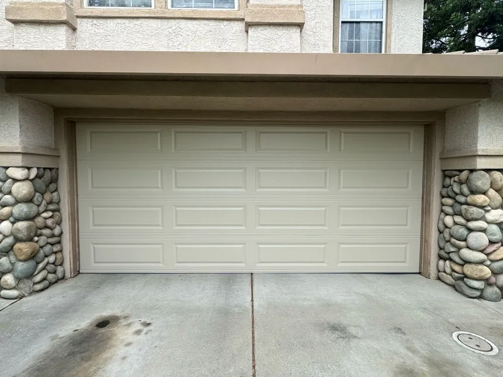 After: a new long-panel door fitted to the same opening - Garage Door Doctor'Z